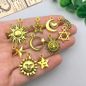 Antique gold alloy celestial charms featuring sun, moon and star designs for DIY jewelry