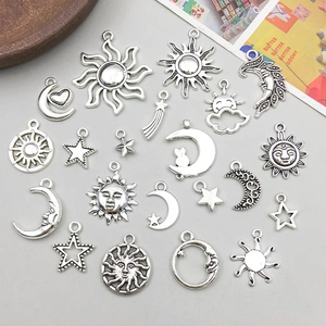 Vintage silver alloy celestial charms featuring sun, moon, and stars for DIY jewelry