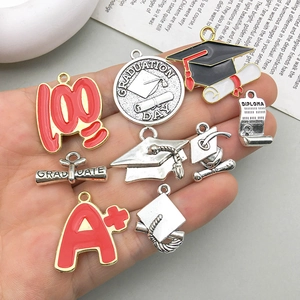 Handheld collection of graduation-themed DIY alloy charms with red A+ and 100 motifs