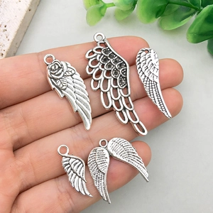 Five styles of antique silver wing pendants for DIY jewelry making and necklaces