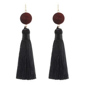 Retro bohemian long black tassel earrings with dark red-brown wooden beads on white background