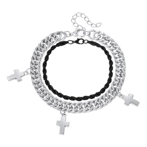 Detail of silver Cuban chain with cross pendants and black braided cord bracelet set