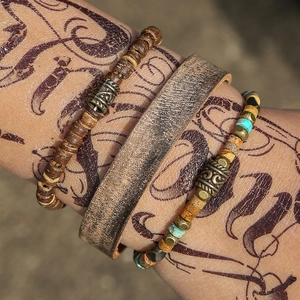 3-piece bohemian multilayer leather bracelet set with wooden beads and ethnic charms