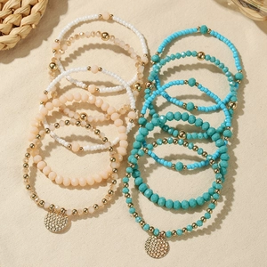 Boheems elastisch glaskralen armbanden setje met goudkleurige bedeltjes