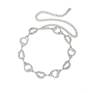 Close-up of vintage engraved silver link waist chain with adjustable lobster clasp