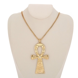 Detail of golden Ankh pendant with center crystal on box chain for men and women