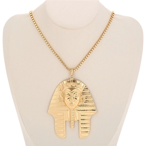 Detail showing Egyptian Pharaoh pendant with intricate texture on a golden box chain