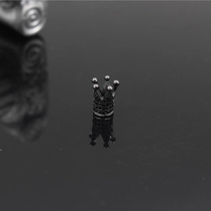 Macro detail of crown bead with black micro-paved rhinestones for DIY jewelry