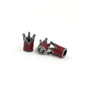 Detailed view of gunmetal alloy crown beads with red rhinestones for DIY jewelry making
