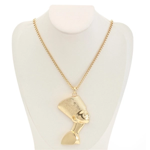 Macro detail of Egyptian Queen Nefertiti pendant with polished gold square chain link