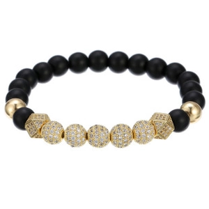 Detailed view of handmade woven bracelet with black matte beads and gold zircon accents
