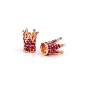 Macro view of rose gold crown charms with purple zirconia stones for DIY jewelry making