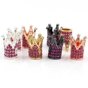 Detailed macro view of alloy crown beads with pink rhinestones for DIY jewelry making