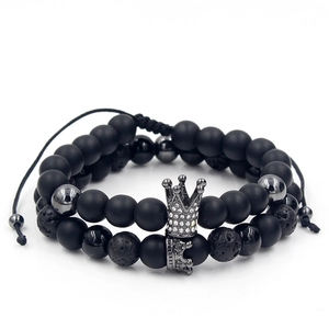 Close-up of crown bracelets with black lava beads and micro-pave white crystals