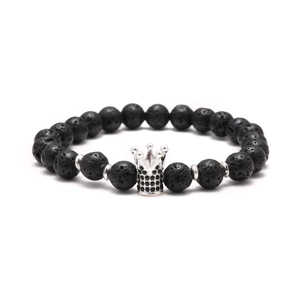 Lava stone beaded bracelet featuring a silver crown pendant with black zircon stones