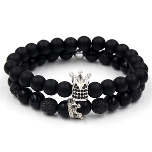 Matte black stone and lava rock beaded bracelet set with silver diamond crown charm