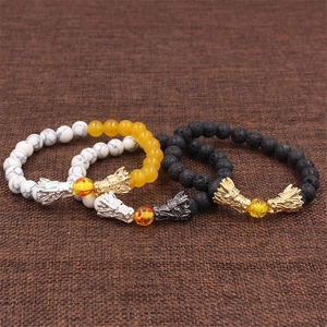Set di tre braccialetti con testa di drago in pietra lavica, marmo e perline citrine
