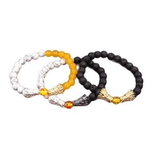 Bracciali con testa di drago in pietra lavica e turchese in nero, bianco e ambra