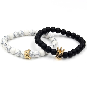 Crown coupled bracelets set with matte black beads and white turquoise stones