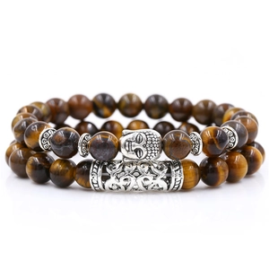 Tiger eye stone bead bracelet set with silver Buddha head and textured metal tube charm