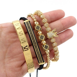 Detail of four-piece set with Roman numeral bracelet, crown beads and black woven zironia