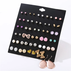 Detailed set of 30 pairs of earrings featuring pearls, crystals, and floral designs on card