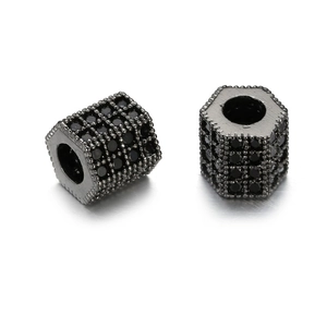 Macro detail of hexagonal gun black spacer beads with micro-pave black zircon settings