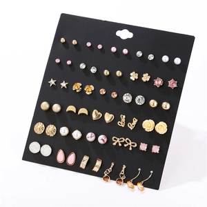 Detailed set of 30 pairs of assorted stud earrings with pearls and crystals on black card