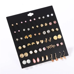 Detailed view of 30 pairs assorted stud earrings set with pearls and rhinestones