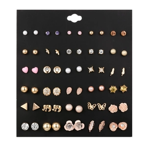 Close-up of 30 pairs stud earrings set featuring pearls and crystals on display card