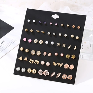 Detailed set of 30 pairs of gold and silver studs featuring pearls and crystals
