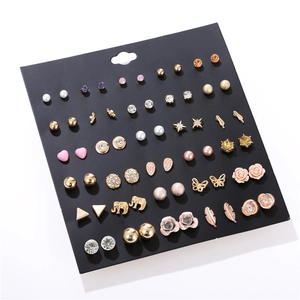 Detailed set of thirty gold and silver earrings with pearls and crystal rhinestones