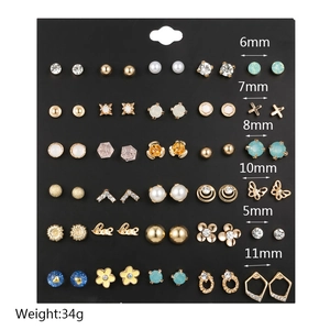 Detailed collection of 30 pairs of pearl and crystal stud earrings with size markings