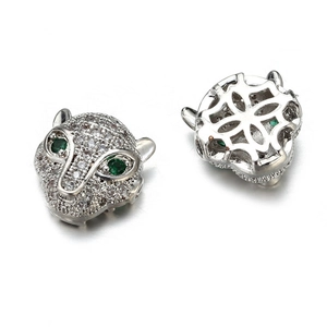 Silver leopard head bead with cubic zirconia and green eyes showing front and back views