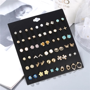 Detailed set of 30 pairs golden geometric earrings with pearls and crystal rhinestones