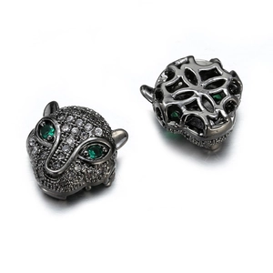 Micro-paved leopard head bead with green zircon eyes and white stones in black gold finish