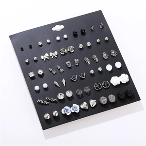 Detail view of 30 pairs earring set featuring pearls, rhinestones and heart shapes