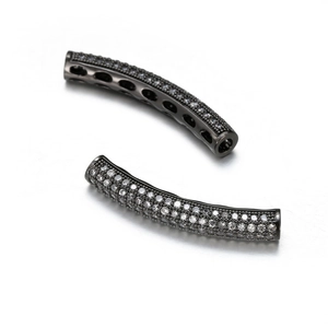 Macro detail of curved tube beads with pavé cubic zirconia in black gunmetal plating