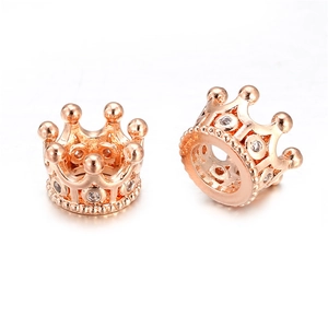 Macro shot of rose gold crown charm beads with micro-set white zircon for DIY jewelry