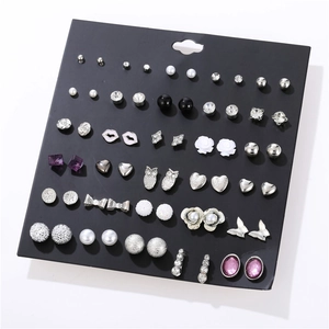 Detailed set of 30 pairs of trendy silver earrings featuring various shapes on black card