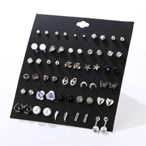 Detailed collection of 30 pairs of silver-tone earrings with pearls and crystals