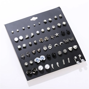 Detailed set of 30 pairs of stud earrings featuring pearls, crystals and metal motifs