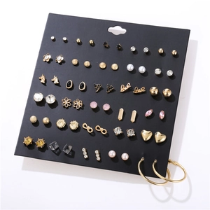 Detailed set of 24 pairs gold earrings with pearls, crystals and geometric shapes