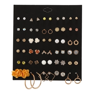 Detailed set of 30 pairs including pearls, rhinestones and hoops on a black display card