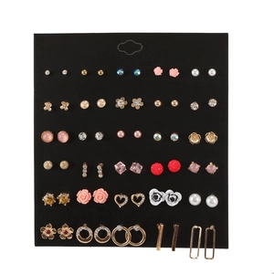 Detail of 30-pair earring set featuring pearls, crystals and floral geometric designs