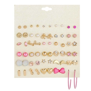 Detail of 30 pairs earring set with gold accents, pearls, and crystals on white card