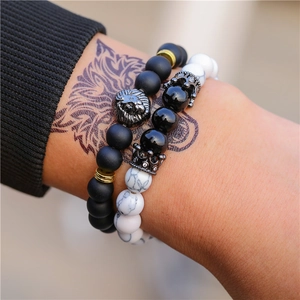 Men's matte black stone and white marble bead bracelet set with lion and crown charms