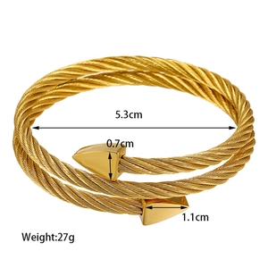 Golden twisted cable titanium steel bracelet with triangular end caps and 5.3cm inner diameter