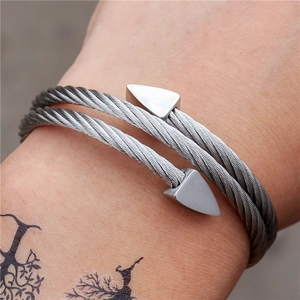 Silver stainless steel cable bangle with a double-layered design and triangle end caps