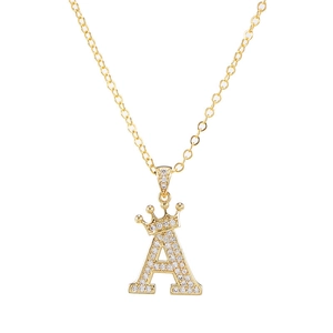 Close-up of golden letter A pendant with crown design and shimmering zircon stones